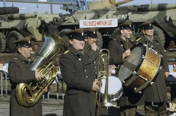 Framed Print : Russian military band playing in front of a train transporting armoured vehicles during the withdrawal of Soviet troops Framed Print : Russian military band playing in front of a train transporting armoured vehicles during the withdrawal of Soviet troops