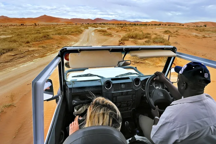 Framed Print : In Safari car on the dunes of the Sossusvlei Framed Print : In Safari car on the dunes of the Sossusvlei