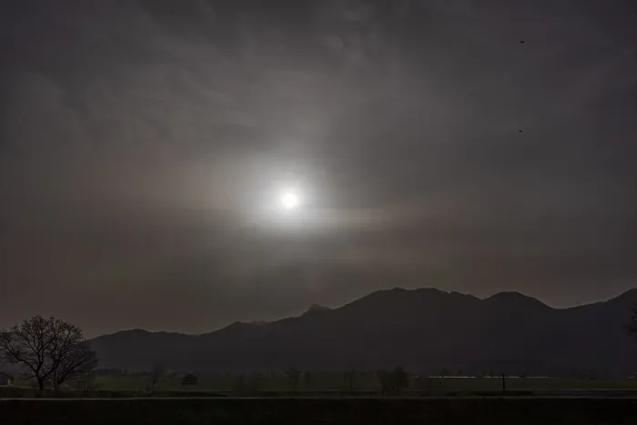 Framed Print : Sahara dust covers the sun in front of a mountain landscape