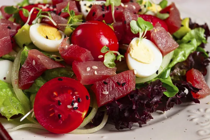 Framed Print : Salad with fresh tuna, cherry tomatoes and quail eggs and avacado