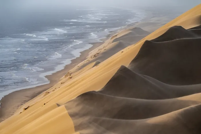 Framed Print : Sand dunes and sea in evening light Framed Print : Sand dunes and sea in evening light