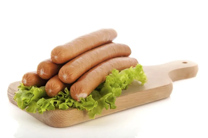 Framed Print : Sausages on wooden cutting board Framed Print : Sausages on wooden cutting board