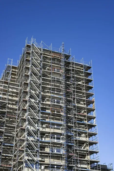 Framed Print : Scaffolded high-rise residential building with balconies and satellite dishes