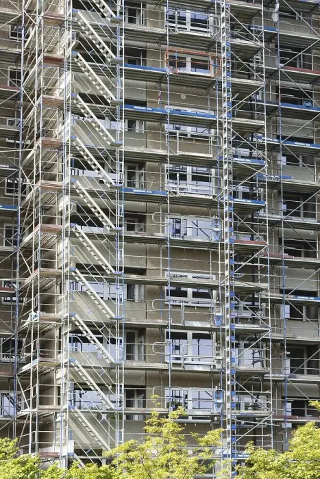 Framed Print : Scaffolded high-rise residential building with balconies and satellite dishes