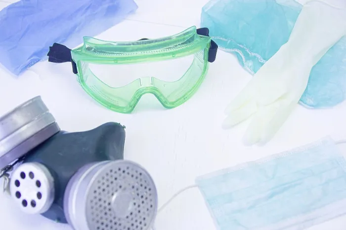 Framed Print : Scene of safety gear with goggles and a gas mask surrounded by gloves