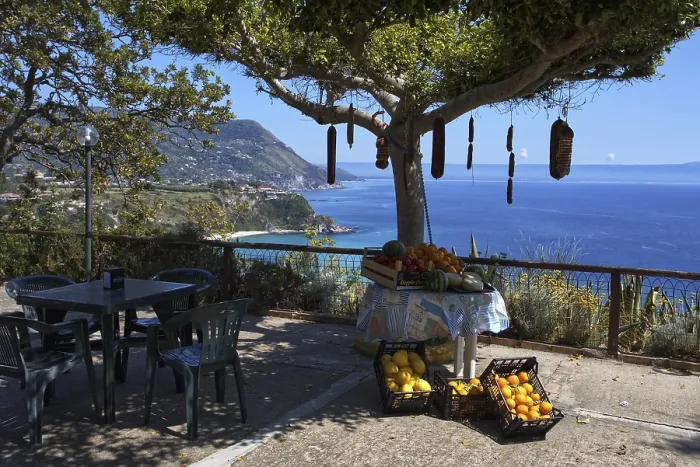 Framed Print : Scenic view of the sea from a restaurant terrace with fruit and a small table Framed Print : Scenic view of the sea from a restaurant terrace with fruit and a small table