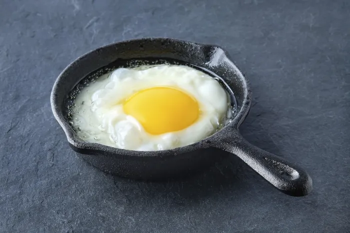 Framed Print : Scrambled egg in small cast-iron skillet