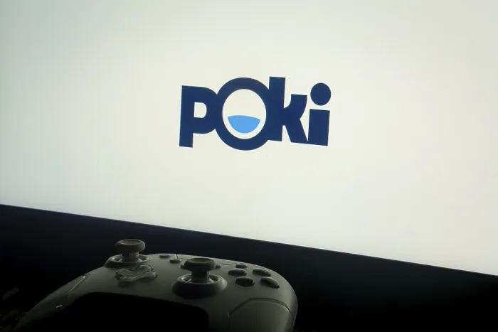 Framed Print : A screen showing the Poki logo with a gaming controller in front