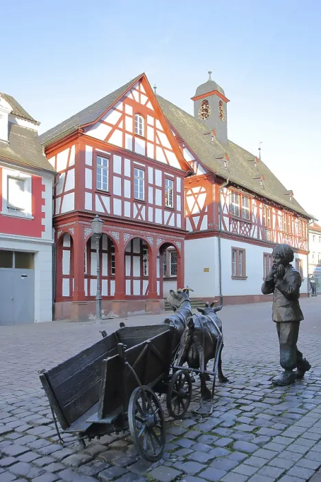 Framed Print : Sculpture with boy and broken cart in front of the town hall Framed Print : Sculpture with boy and broken cart in front of the town hall