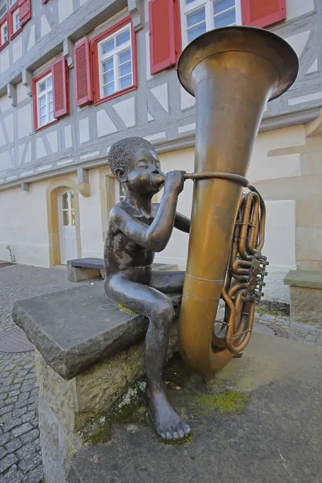 Framed Print : Sculpture boy with tuba by Guido Messer 1991 Framed Print : Sculpture boy with tuba by Guido Messer 1991