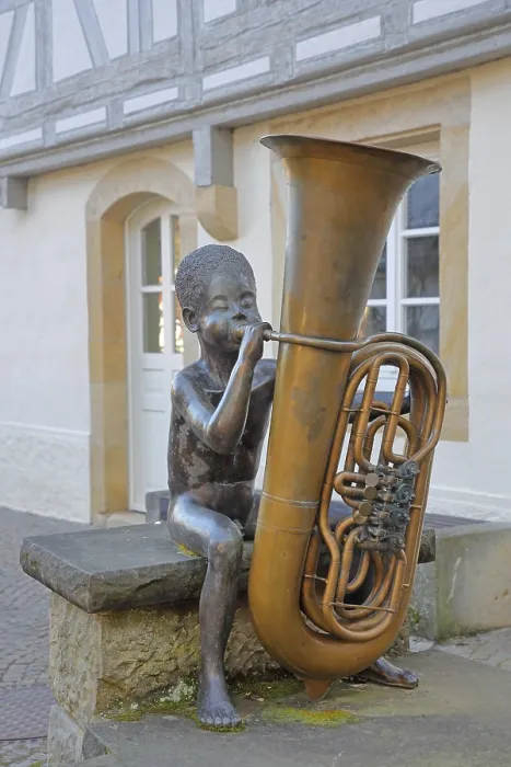 Framed Print : Sculpture boy with tuba by Guido Messer 1991 Framed Print : Sculpture boy with tuba by Guido Messer 1991