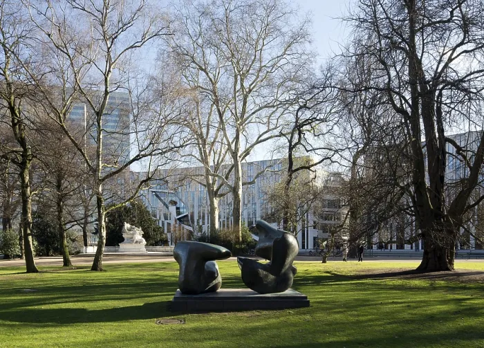 Framed Print : Sculpture by Henry Moore, war memorial on the left