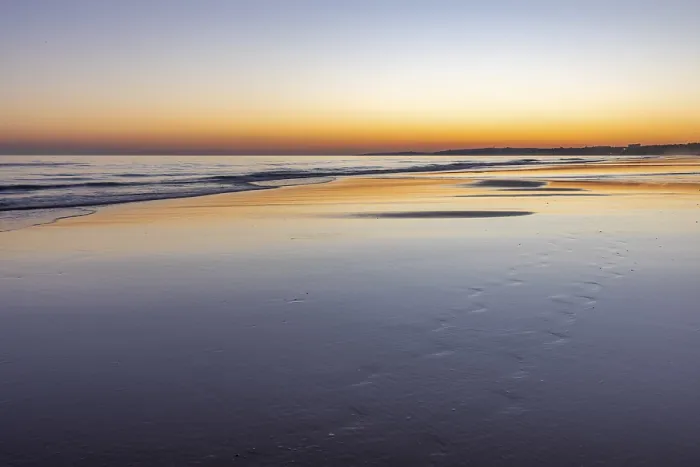 Framed Print : Sea with reflection at low tide in the calm waters of the Atlantic