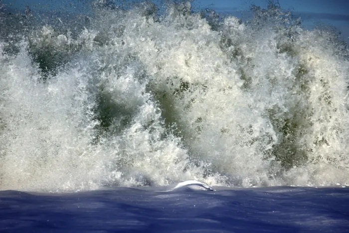 Framed Print : Sea rolling and receding water in rays of setting sun Framed Print : Sea rolling and receding water in rays of setting sun