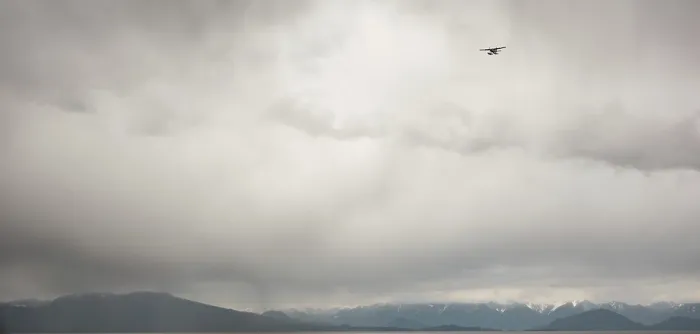 Framed Print : A seaplane flying against a backdrop of cloudy sky Framed Print : A seaplane flying against a backdrop of cloudy sky