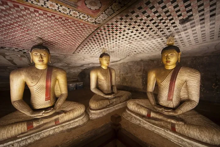 Framed Print : Seated Buddha statues in the Dambulla cave temple Framed Print : Seated Buddha statues in the Dambulla cave temple
