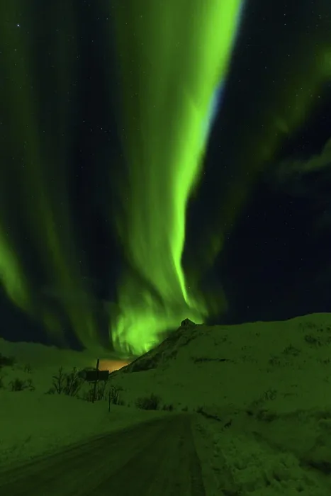 Framed Print : Serene green aurora borealis gracefully illuminates a peaceful snowy hillside against the night