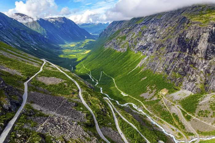 Framed Print : The serpentine road meanders on the green slopes of the canyon