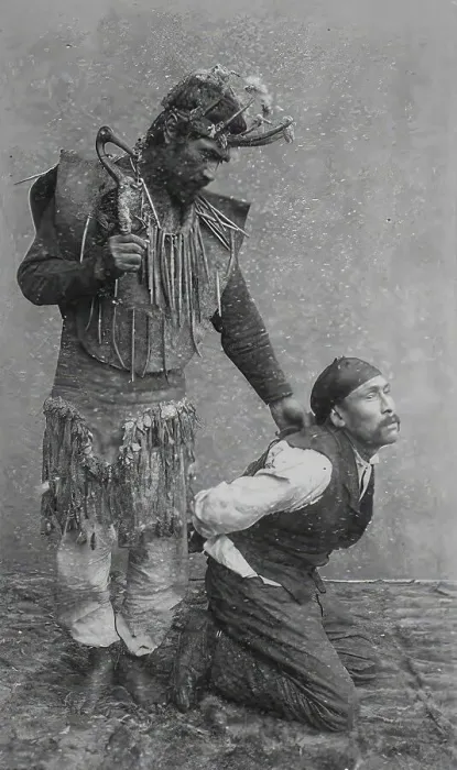 Framed Print : Shaman holding a man on his knees
