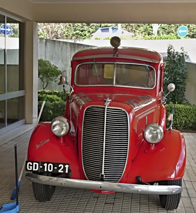 Framed Print : Shiny vintage Ford fire engine parked in a garage Framed Print : Shiny vintage Ford fire engine parked in a garage