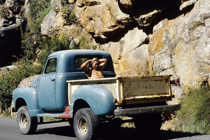 Framed Print : Shirtless young man sitting in the back of an old Chevrolet pick-up truck Framed Print : Shirtless young man sitting in the back of an old Chevrolet pick-up truck
