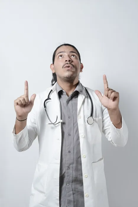 Framed Print : Shocked doctor looking up on isolated Framed Print : Shocked doctor looking up on isolated