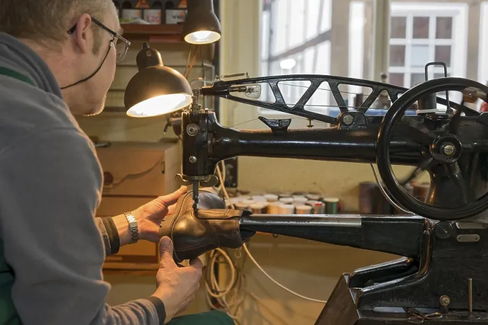 Framed Print : Shoemaker, shoemaker sews shoe to machine