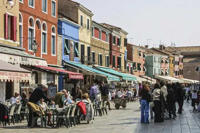 Framed Print : Shopping street with cafes, local passers-by