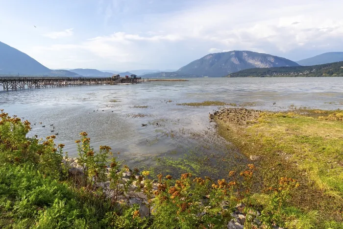 Framed Print : Shuswap lake reflecting a clear blue sky and framed by majestic mountains