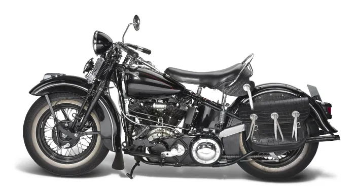 Framed Print : Sideways shot of a vintage motorbike in white back
