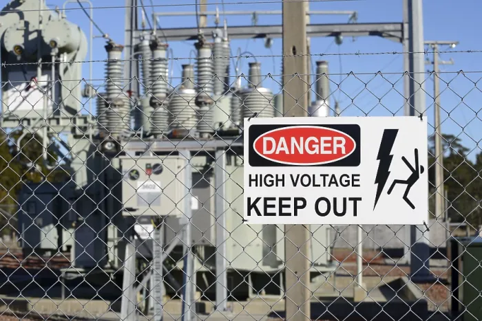 Framed Print : Signage warns people against high voltage accessing an electrical sub-station