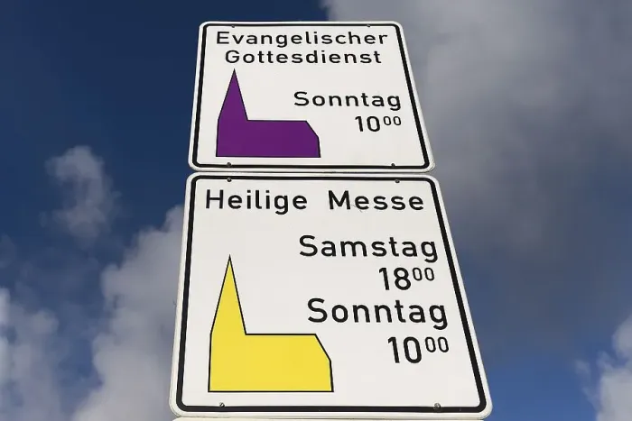 Framed Print : Signs indicating religious services of both denominations