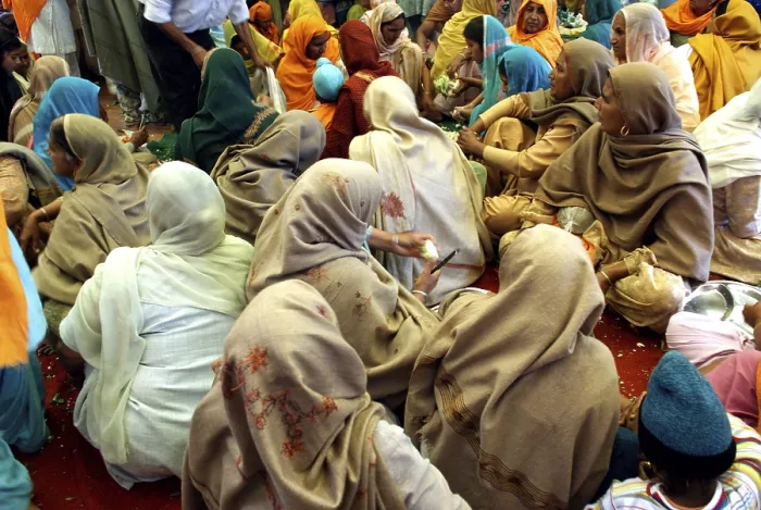 Framed Print : Sikh devotees offer voluntary services called as seva at guru ka langar known as community kitchen in Golden temple