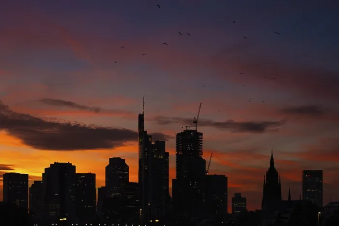 Framed Print : The silhouette of Frankfurt's banking skyline stands out against the luminous evening sky in the evening after