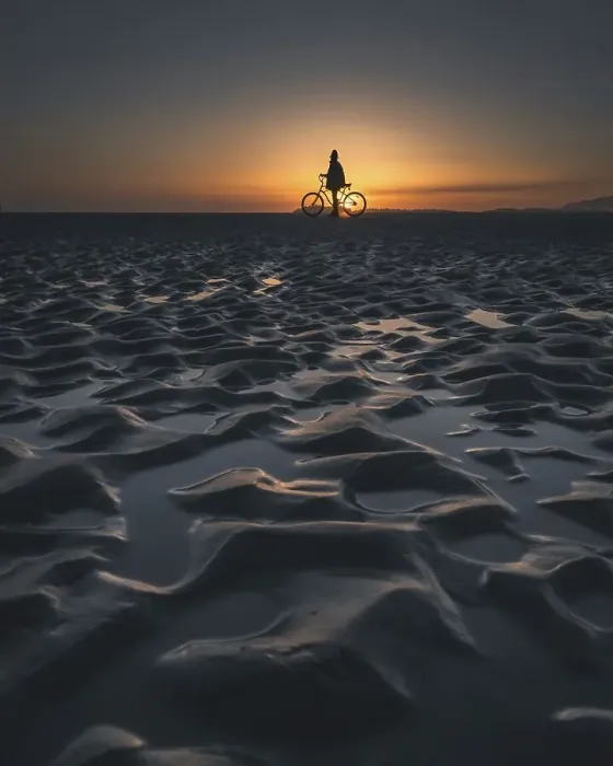 Framed Print : Silhouette of a person with a bicycle on a beach during a picturesque sunset, Tofino, BC, Canada, North America Framed Print : Silhouette of a person with a bicycle on a beach during a picturesque sunset, Tofino, BC, Canada, North America