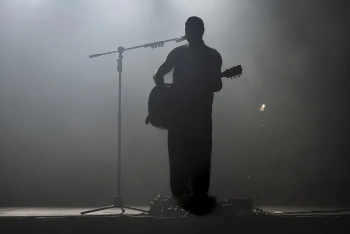 Framed Print : Silhouette of rock star with guitar on the stage in Lubin