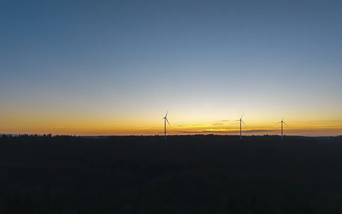 Framed Print : Silhouette of wind turbines in front of a colourful sunset sky Framed Print : Silhouette of wind turbines in front of a colourful sunset sky