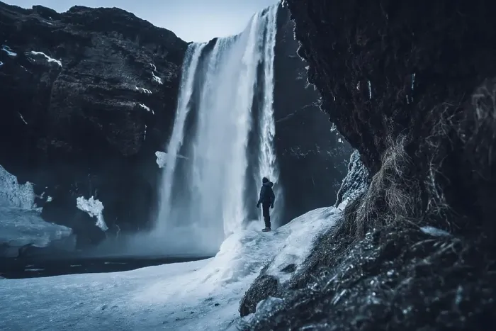 Framed Print : Silhouette of woman in winter in Iceland under Skogafoss waterfall Framed Print : Silhouette of woman in winter in Iceland under Skogafoss waterfall