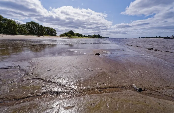 Framed Print : Silt is exposed when the water level of the Weser is low on the island of Harriersand