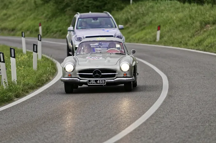 Framed Print : Silver Mercedes classic car on a country road with an SUV in the background