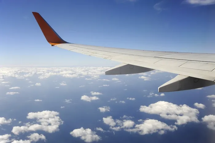 Framed Print : Silver wing, Boeing 737-800 aeroplane flying over the clouds Framed Print : Silver wing, Boeing 737-800 aeroplane flying over the clouds