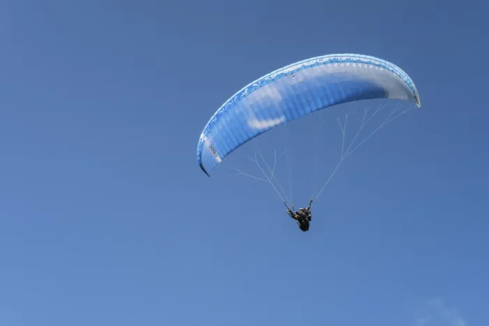 Framed Print : Single paraglider in the blue sky symbolizing freedom and adventure