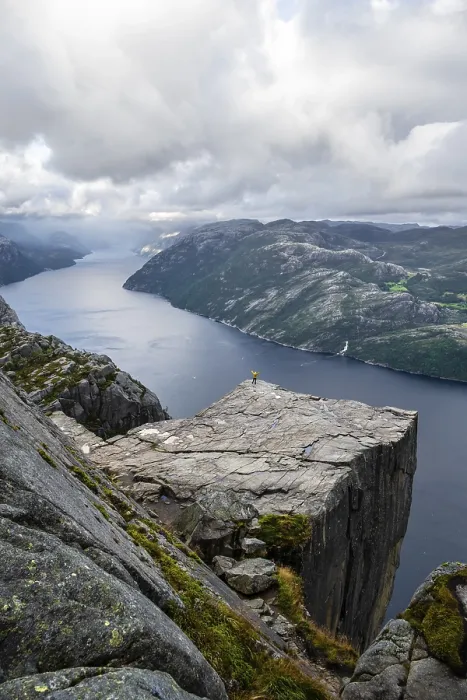 Framed Print : Single person on rock plateau, Preikestolen rock spire Framed Print : Single person on rock plateau, Preikestolen rock spire
