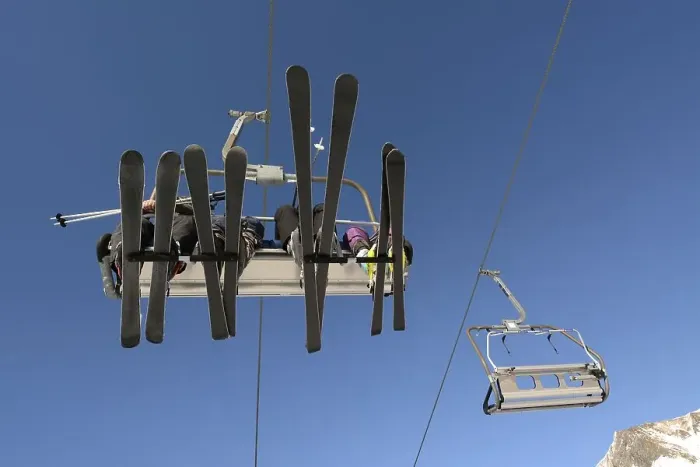 Framed Print : Ski lift and skiers, children and an adult
