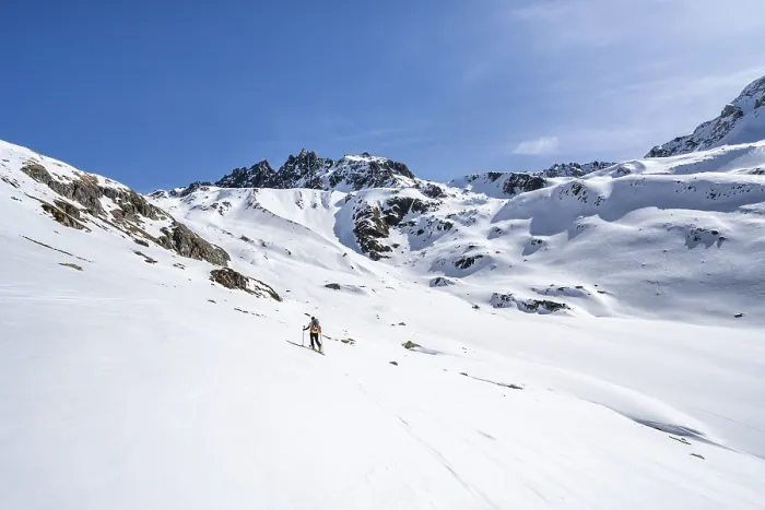 Framed Print : Ski tourer in mountain landscape with snow Framed Print : Ski tourer in mountain landscape with snow