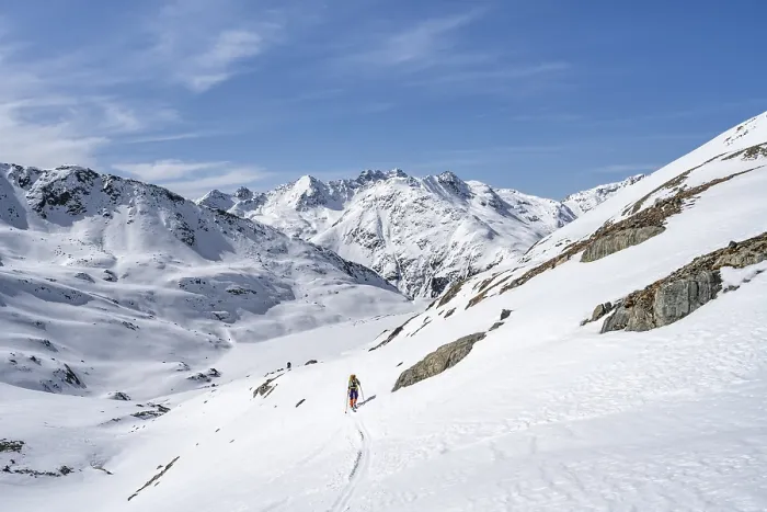 Framed Print : Ski tourer in mountain landscape with snow