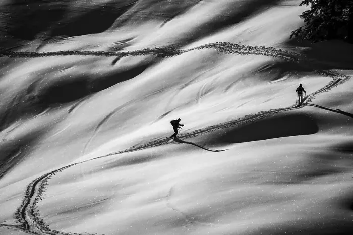 Framed Print : Ski tourers ascending in black and white Framed Print : Ski tourers ascending in black and white