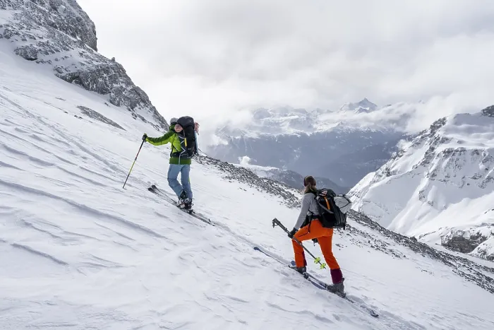 Framed Print : Ski tourers in a snowy mountain landscape