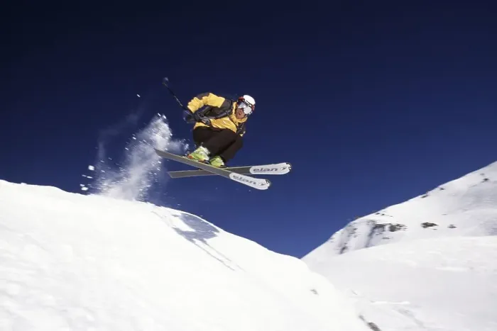 Framed Print : Skier jumps