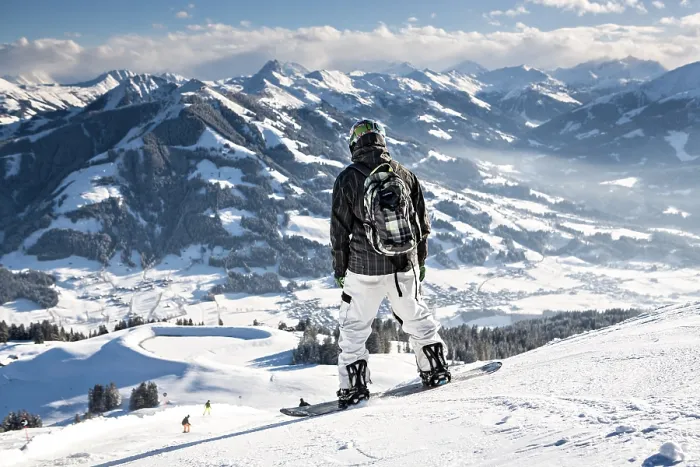 Framed Print : Skier overlooking Wilder Kaiser ski area in the Alps